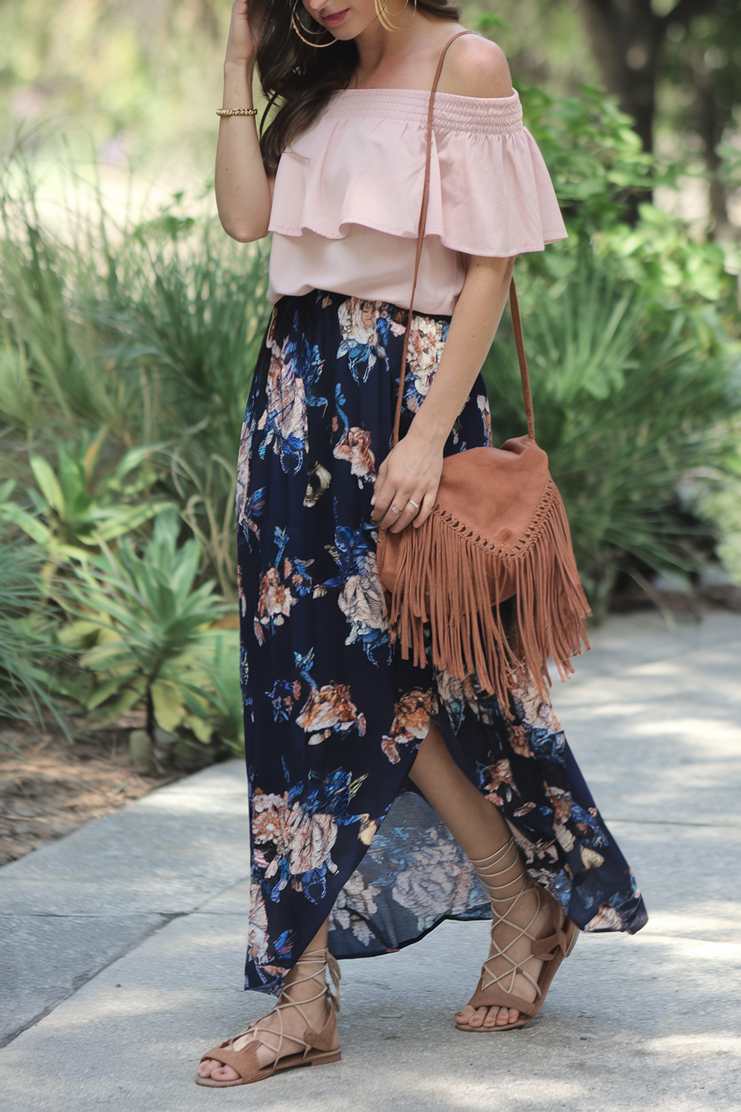 Woman in stylish outfit walking through a lush garden path on a sunny day.