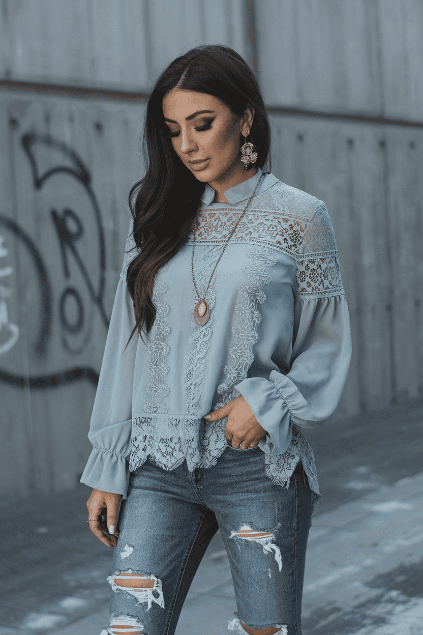 Confident woman in blue blouse and jeans poses against urban graffiti background.