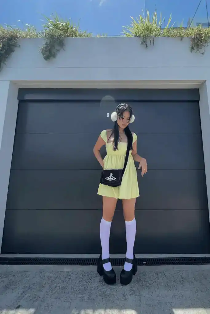 young women wearing a yellow summer dress with mary jane shoes