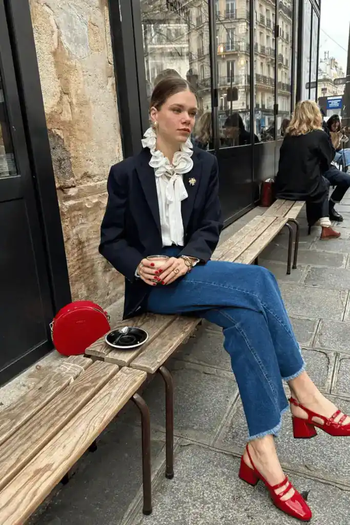 women wearing a smart casual outift with a red bag and red mary jane shoes