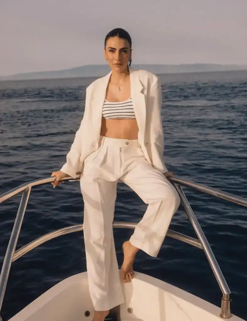 woman wearing a cream colour linen coord trouser set