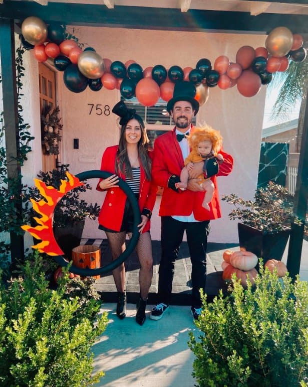 Circus Family: Ringmaster, Performer, and Baby Lion