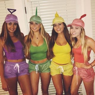 Best friends wearing colorful matching Halloween costumes, posing together in playful cartoon-inspired outfits.