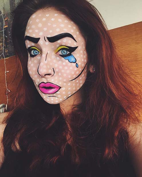 Pop art comic book makeup on woman with red hair and dramatic colorful face paint.