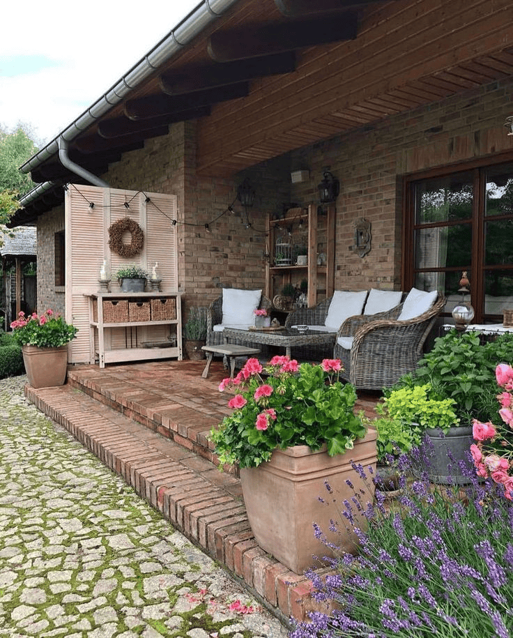 Brick Pathway and Colorful Pots Create Cozy Charm