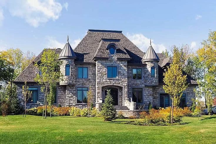 Four-Story Stone Château Mirrors Rose Dusk in the Moat