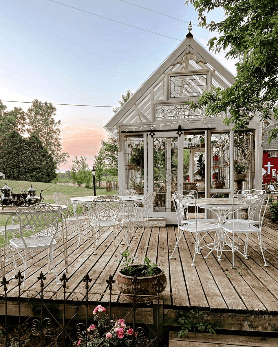 Outdoor Patio Seating Overlooks the Greenhouse and Garden