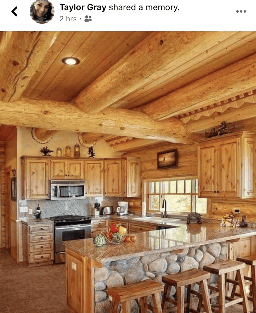 Rustic Kitchen With Stone Island And Beams