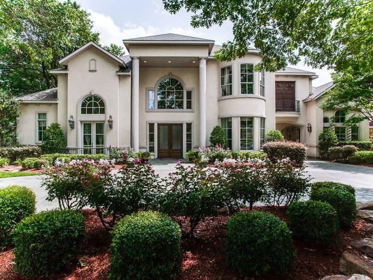 Six Stone Columns Frame the Dramatic Portico Driveway