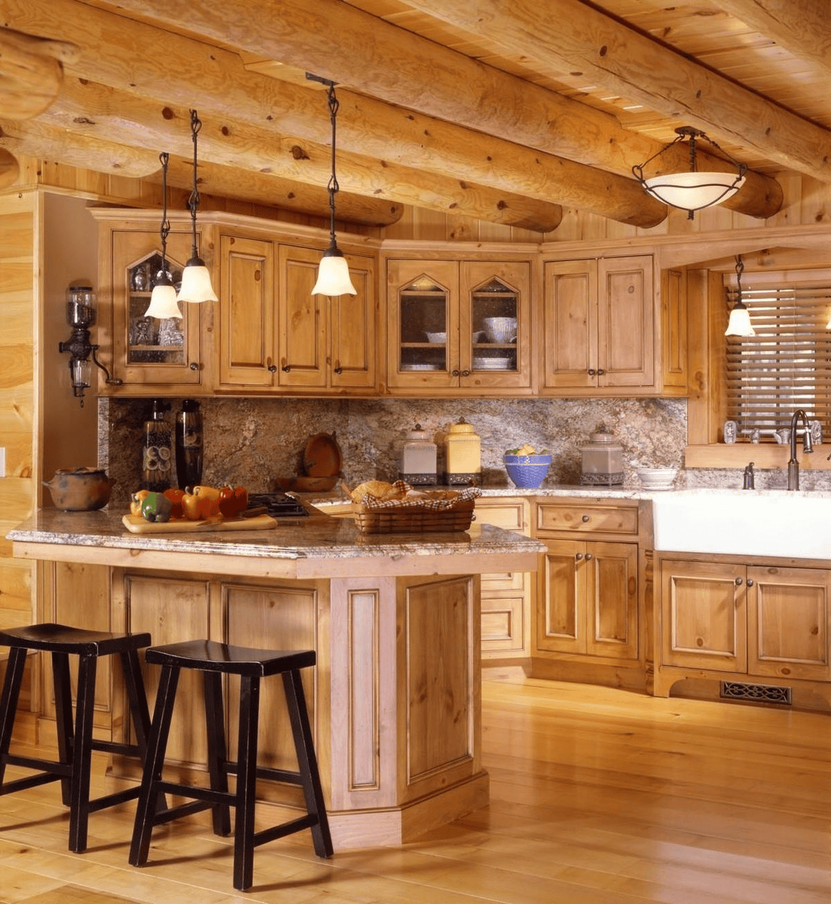 Warm Kitchen With Wooden Cabinets And Pendant Lights