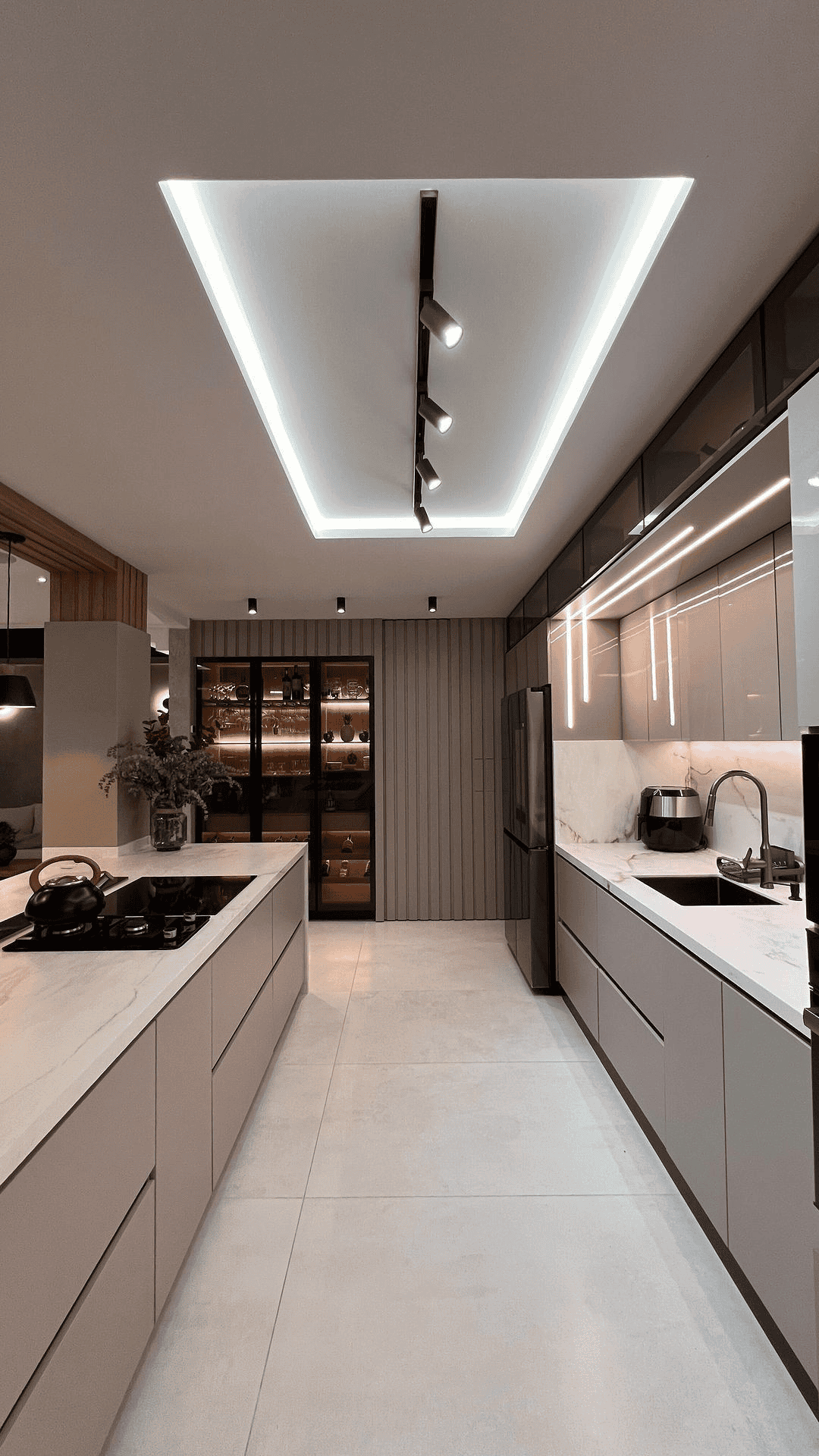 White Kitchen Island With Clean Lines And Modern Lighting