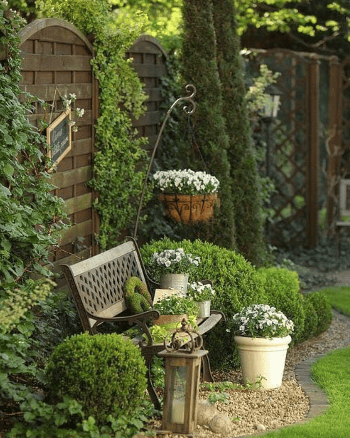 Wrought Iron Bench Creates a Tranquil Garden Corner